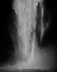 A waterfall painted on a black and white photograph.
