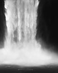 Black and white image of a waterfall with mist