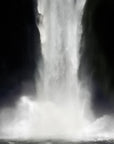 A painted photograph of a waterfall with a black background 