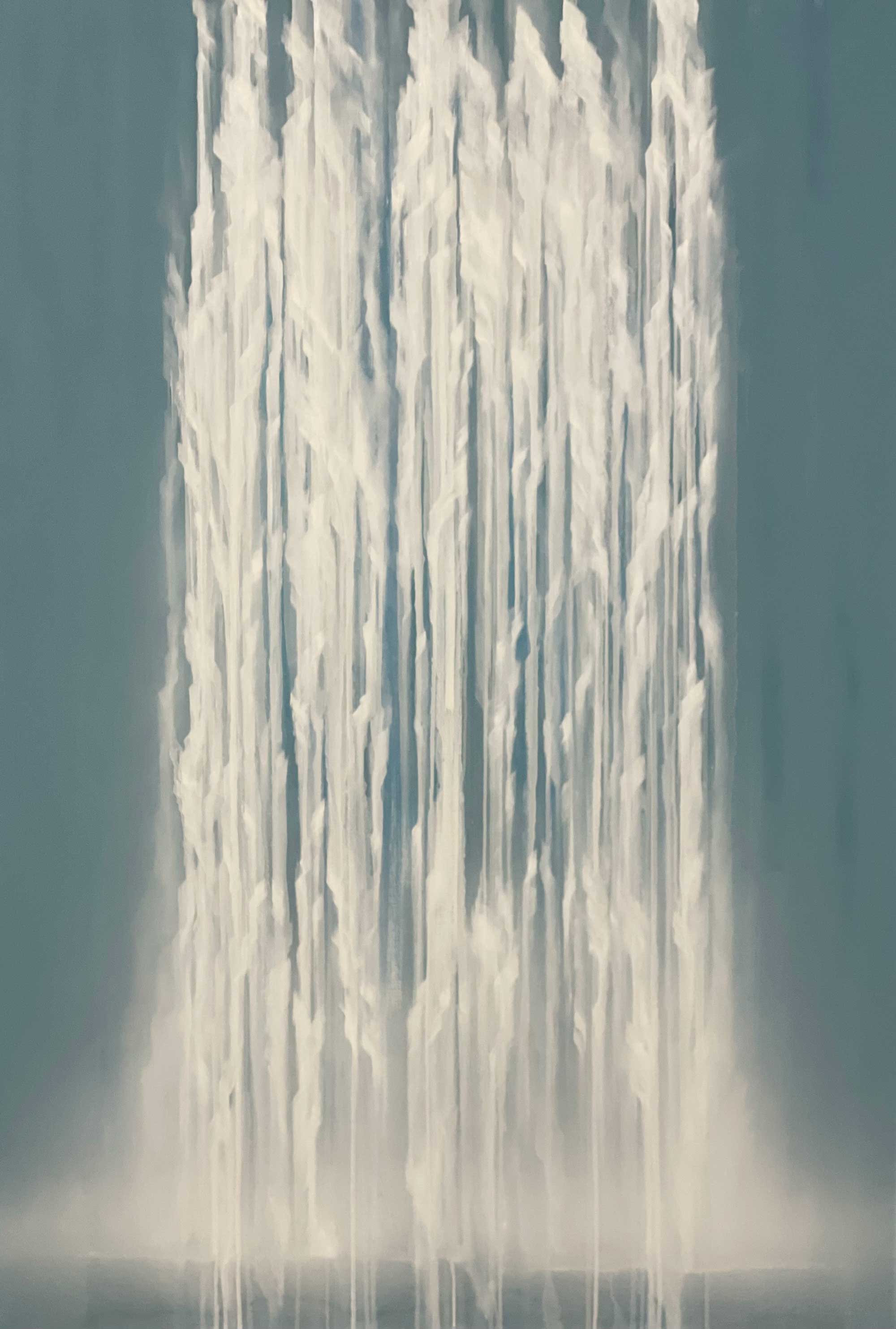 Close-up of a waterfall with water droplets against a dark background